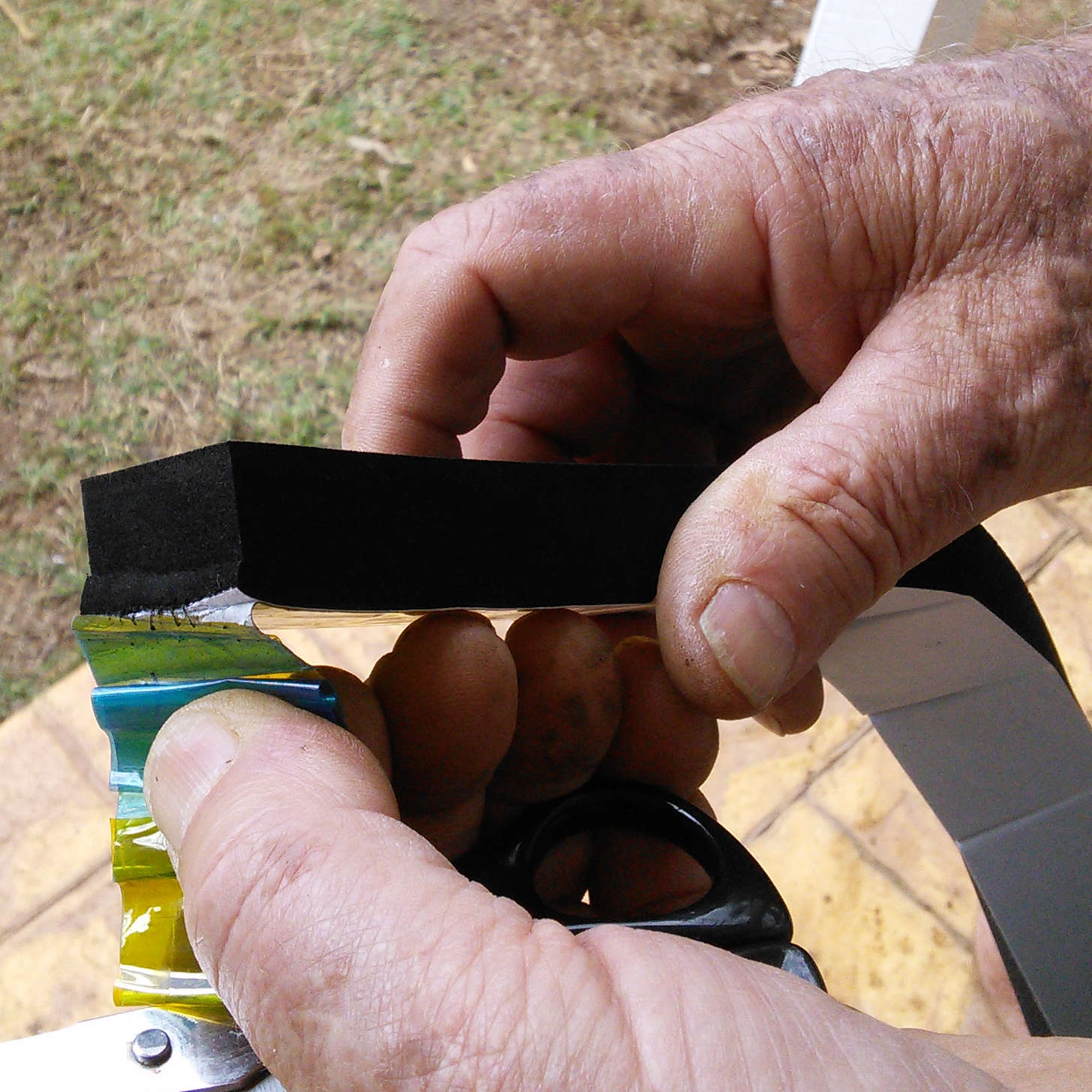 Adhesive Neoprene Foam Tape having it's peel-off adhesive liner removed for installation