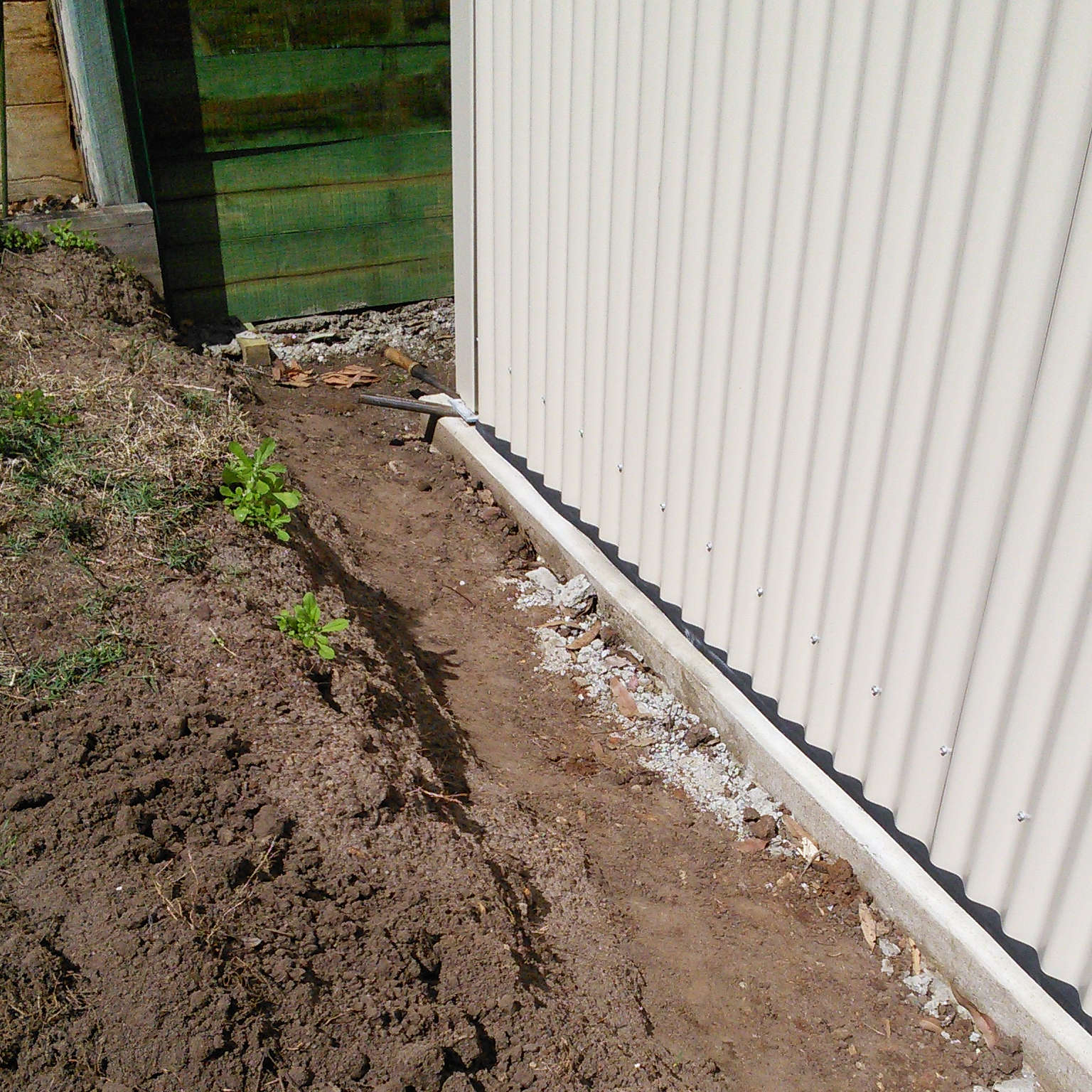 Adhesive Neoprene Foam Tape sealing around a colorbond garden shed