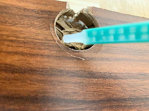 1 - Frayed Hole Being Filled with Epoxy Adhesive Before Furniture Connector is Inserted