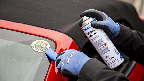 Label Remover Spray used to remove a car window sticker 