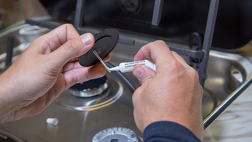 Food Grade Anti Seize High Tech Being Applied to A Stove Burner, Banner