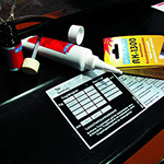 RK-1300 Acrylic MMA Adhesive used to bond nameplate to machinery