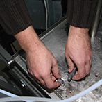 Steel Repair Stick Filling unwanted holes in a steel tray with Epoxy Putty